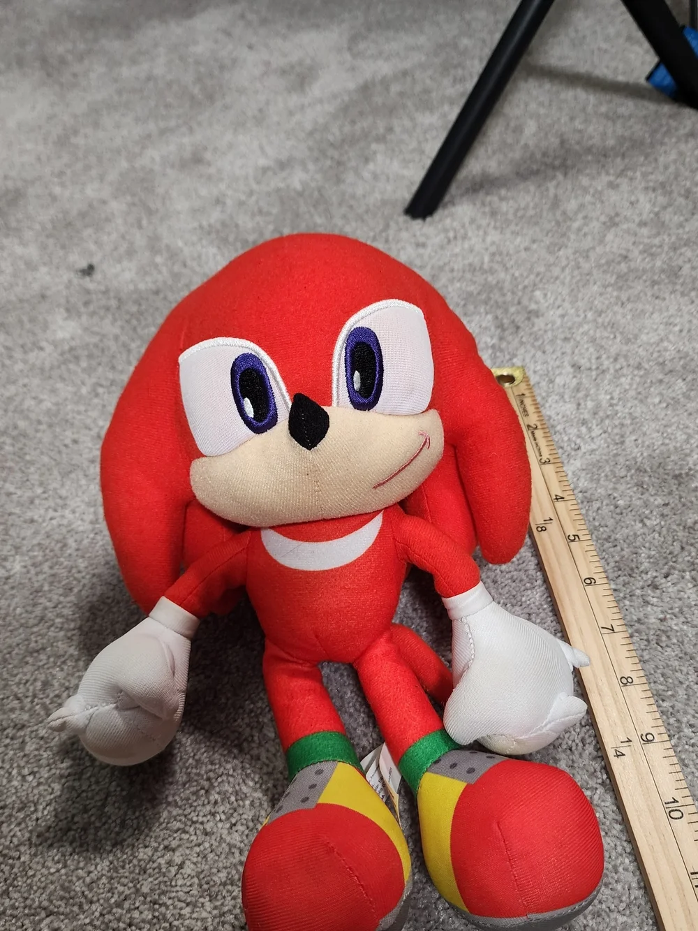 Red Plush Character Toy with White Gloves and Multicolor Shoes